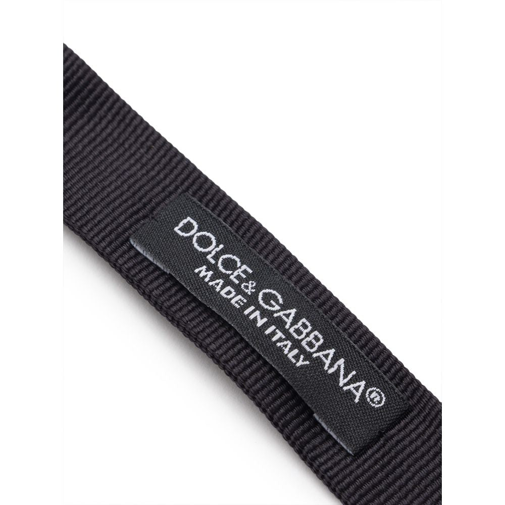 Necktie by Dolce & Gabbana for men in silk black & striped features an stately silhouette that beautifully highlights the sophisticated style of the Silk Necktie.