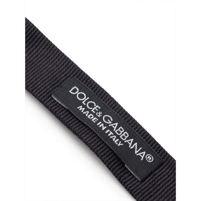 Necktie by Dolce & Gabbana for men in silk black & striped features an stately silhouette that beautifully highlights the sophisticated style of the Silk Necktie.