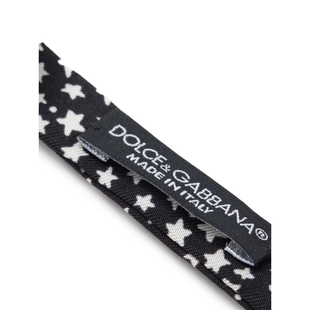 Necktie by Dolce & Gabbana for men in silk black, white & print showcases a stately silhouette, expertly detailed with a stately finish that perfectly captures the sophisticated essence of the Star Silk Necktie.