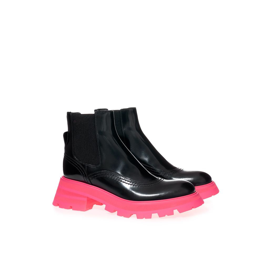 Boots by Alexander McQueen for women in leather black features an dynamic silhouette, showcasing the dynamic Women's Leather Boots design with its distinctive and elegant .