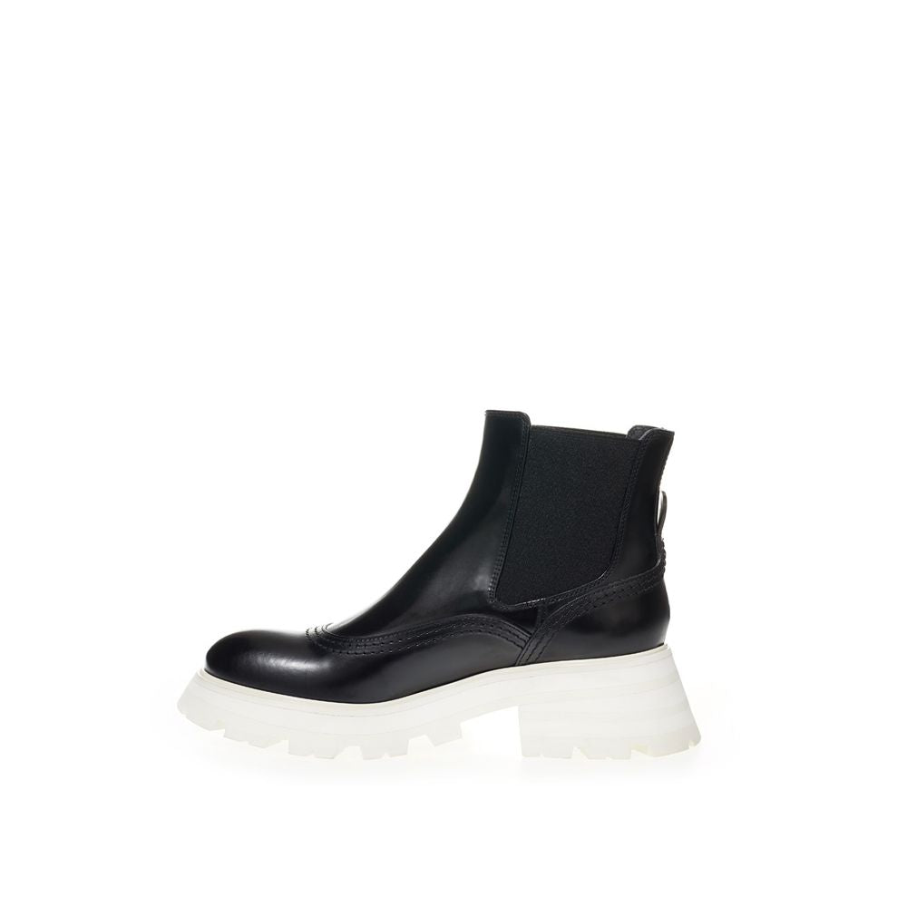 Boots by Alexander McQueen for women in leather black features an dynamic silhouette, showcasing the dynamic Women's Leather Boots design with its distinctive and elegant .