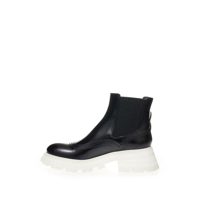 Boots by Alexander McQueen for women in leather black features an dynamic silhouette, showcasing the dynamic Women's Leather Boots design with its distinctive and elegant .