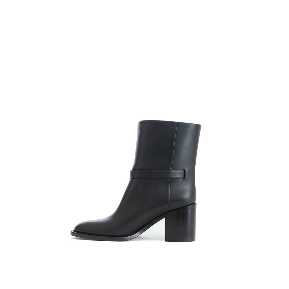 Ankle Strap Boots by Burberry for women in leather black & print features an avant-garde Women's Leather Ankle Strap Boots silhouette, defined by a sophisticated and a avant-garde round toe style.