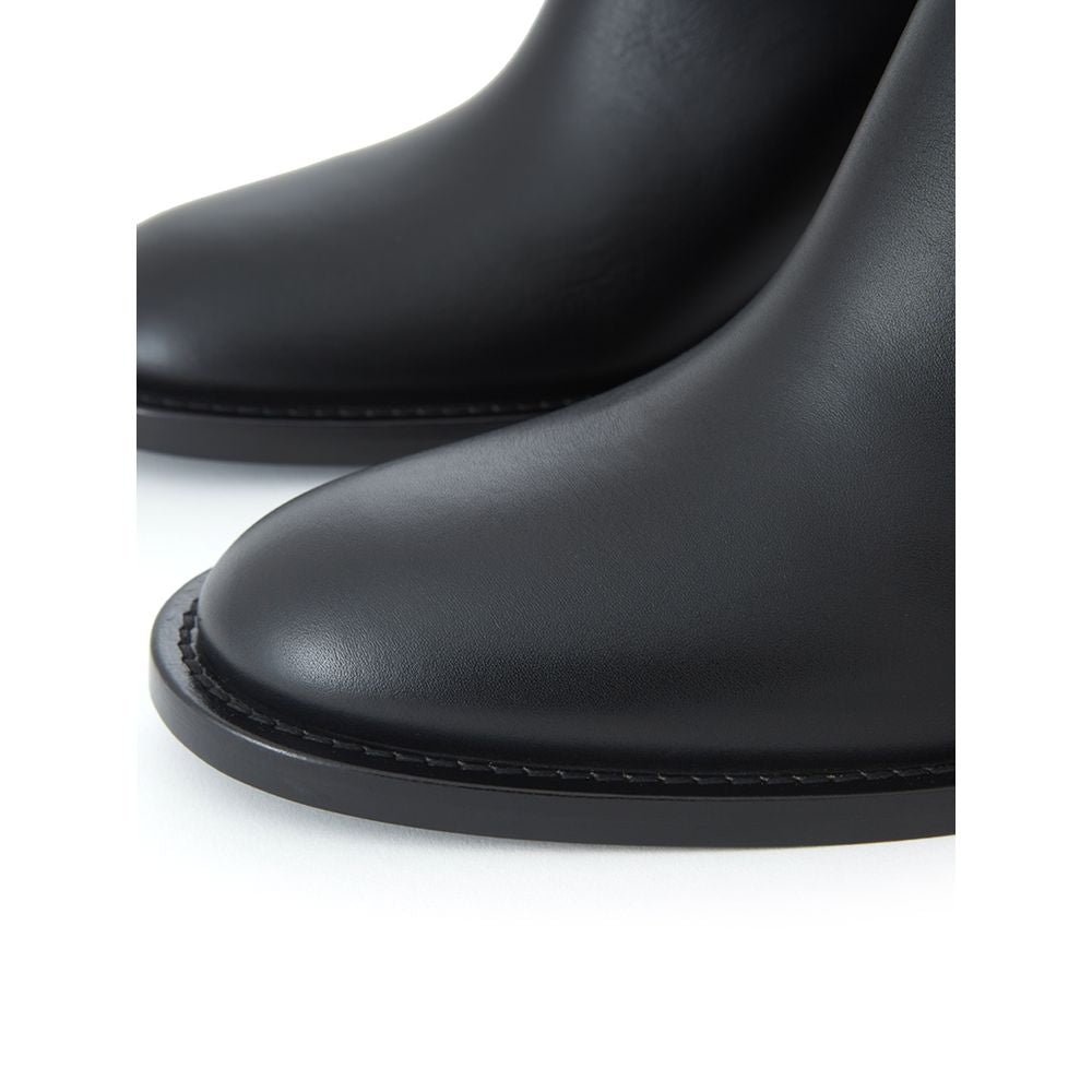 Ankle Strap Boots by Burberry for women in leather black & print features an enchanting design from the Women's Leather Ankle Strap Boots collection, highlighting a enchanting and round toe style for a refined look.