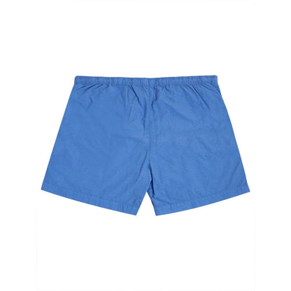 Swim Shorts by C.P. Company for men in polyamide blue showcases a captivating silhouette, expertly capturing the sophisticated essence of the captivating Essence Men's Polyamide Swim Shorts design for a premium poolside look.
