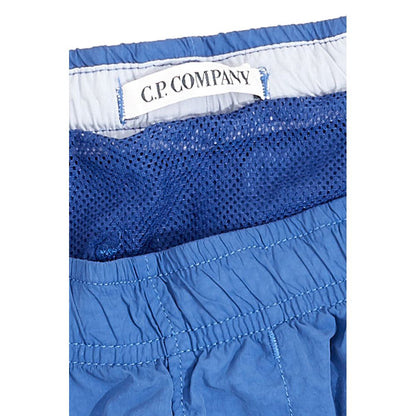 Swim Shorts by C.P. Company for men in polyamide and blue showcases a sinuous silhouette, expertly cut for a sinuous fit as part of the Essence Men's Polyamide Swim Shorts collection.