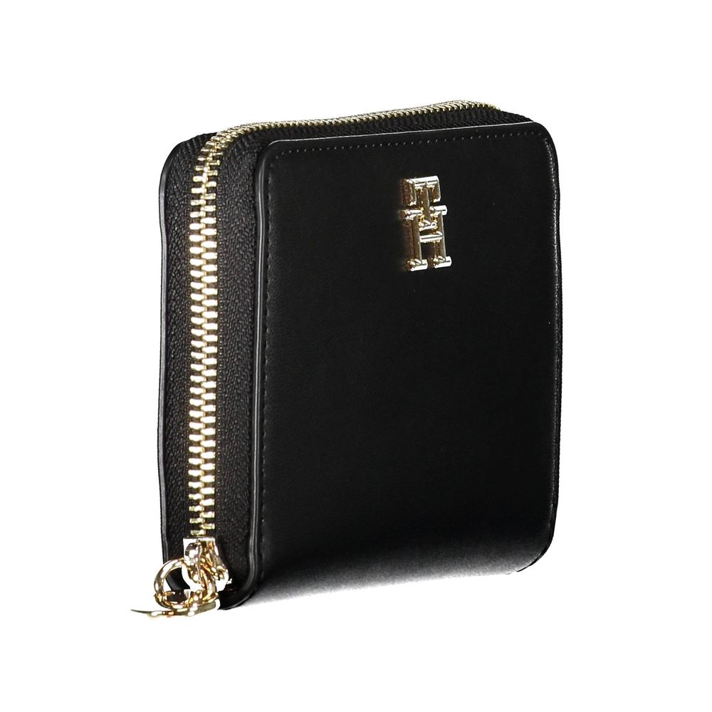 Cardholder Wallet by Tommy Hilfiger for women in polyethylene faux leather black showcases a refined silhouette, artfully detailed with the signature style of the Polyethylene Faux Leather Cardholder Wallet and functional card-organization compact-design zip-around coin-purse.