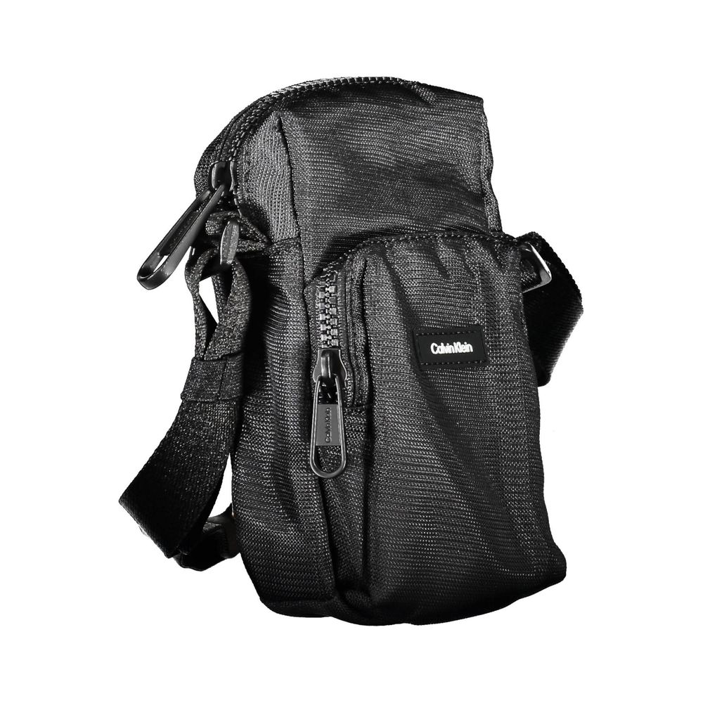Shoulder Bag by Calvin Klein for men in polyester & polyethylene black presents a statuesque silhouette, showcasing a secure zipper and statuesque external-pockets with versatile shoulder-strap & adjustable-strap for a sophisticated look.