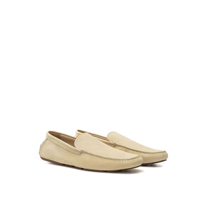 This Loafer Shoes by Bally for men in suede leather & rubber beige features an exquisite silhouette from the Men's Suede Leather & Rubber Loafer Shoes collection, defined by a sophisticated and elegant round toe style.