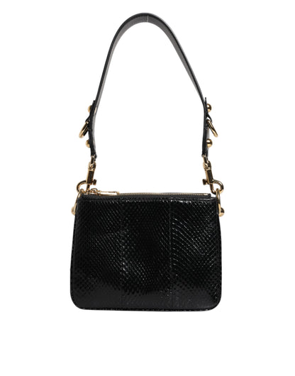 Shoulder Sling Clutch Bag by Dolce & Gabbana for women in exotic leather black & gold features a stately silhouette, showcasing a secure zipper, ample , and stately shoulder-strap, adjustable-strap & detachable-strap for a stately finish.