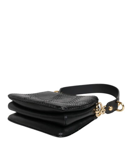 Shoulder Sling Clutch Bag by Dolce & Gabbana for women in exotic leather black & gold presents a statuesque silhouette, showcasing a secure zipper and statuesque with versatile shoulder-strap, adjustable-strap & detachable-strap for a sophisticated look.