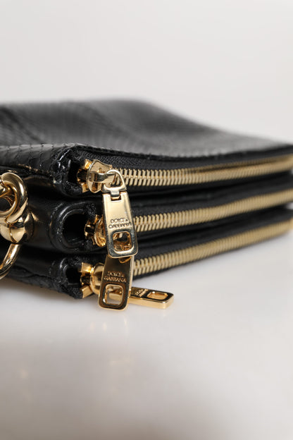 Shoulder Sling Clutch Bag by Dolce & Gabbana for women in exotic leather black & gold features a statuesque silhouette, showcasing a secure zipper and statuesque with versatile shoulder-strap, adjustable-strap & detachable-strap for a statuesque finish.