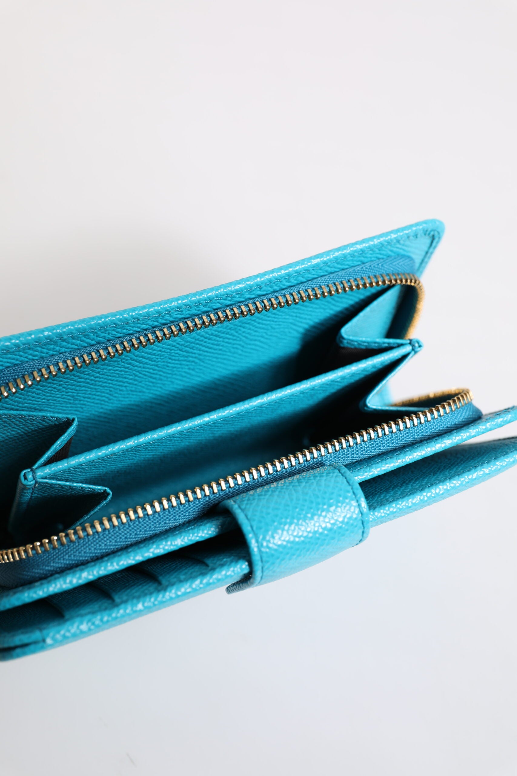 Cardholder Wallet by Dolce & Gabbana for women in patent leather light-blue showcases a refined silhouette, artfully detailed with the signature style of the Patent Leather Cardholder Wallet and functional card-organization compact-design bifold.