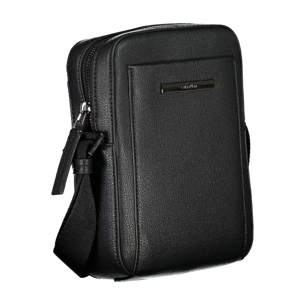 Shoulder Bag by Calvin Klein for men in polyester & polyethylene black features a effortless sophistication silhouette, secured by a zipper with ample external-pockets & internal-pockets and versatile shoulder-strap & adjustable-strap for a effortless sophistication finish.