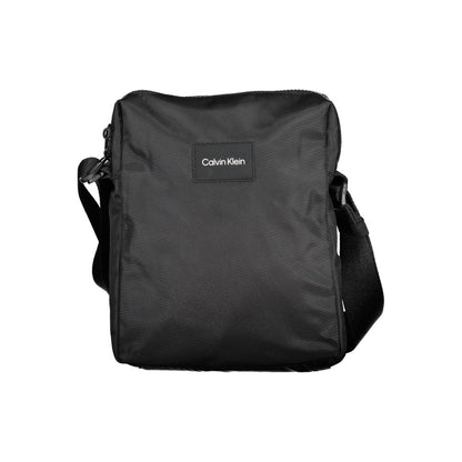 Shoulder Bag by Calvin Klein for men in polyester & polyethylene black presents a statuesque silhouette, showcasing a secure zipper and statuesque internal-pockets with versatile shoulder-strap & adjustable-strap for a sophisticated look.