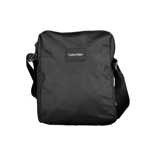 Shoulder Bag by Calvin Klein for men in polyester & polyethylene black presents a statuesque silhouette, showcasing a secure zipper and statuesque internal-pockets with versatile shoulder-strap & adjustable-strap for a sophisticated look.