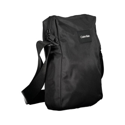 Shoulder Bag by Calvin Klein for men in polyester & polyethylene black presents a statuesque silhouette, showcasing a secure zipper and statuesque internal-pockets with versatile shoulder-strap & adjustable-strap for a sophisticated look.