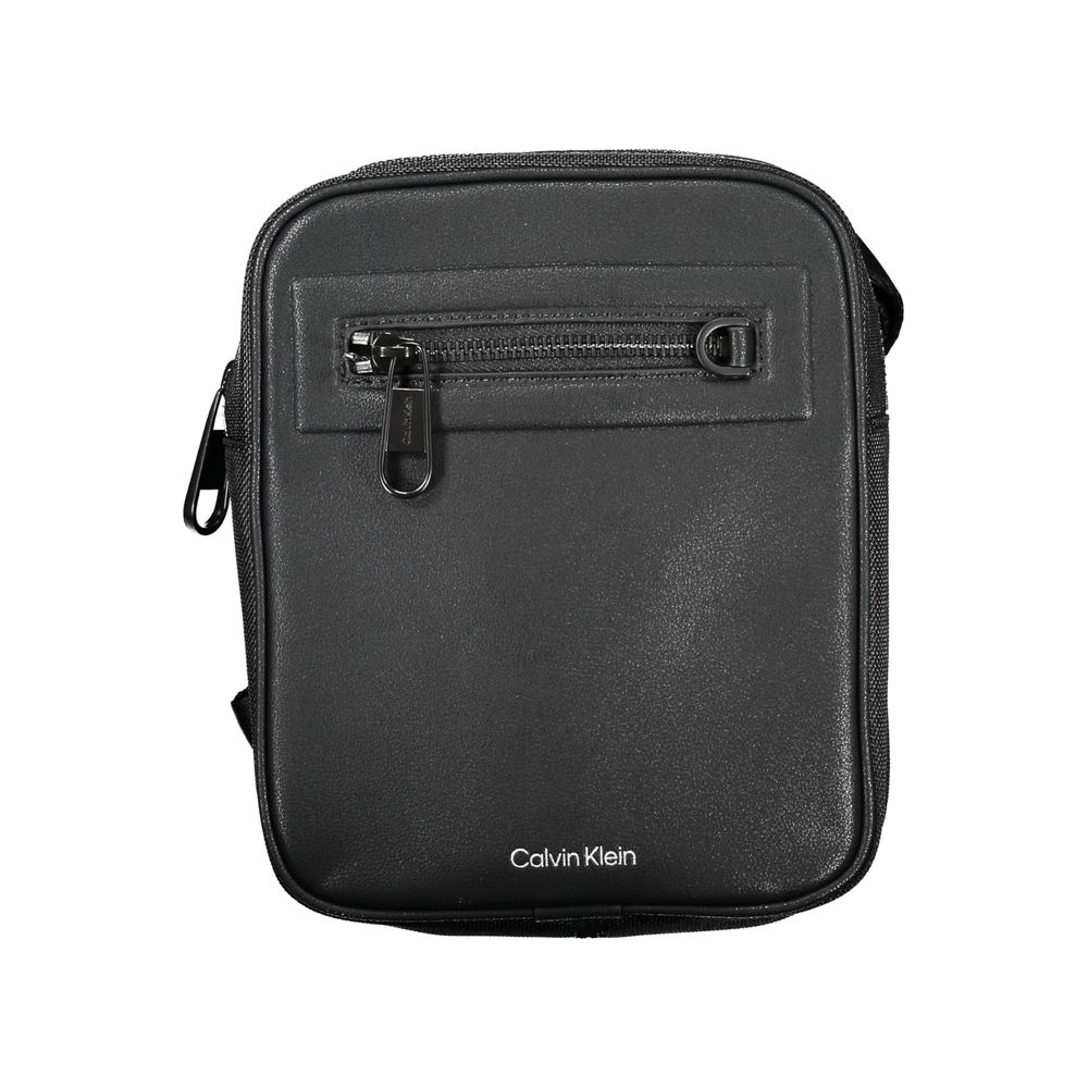 Shoulder Bag by Calvin Klein for men in polyester & polyethylene black features an effortlessly chic silhouette with a secure magnetic, ample external-pockets & internal-pockets, and versatile shoulder-strap & adjustable-strap for effortlessly chic everyday luxury.