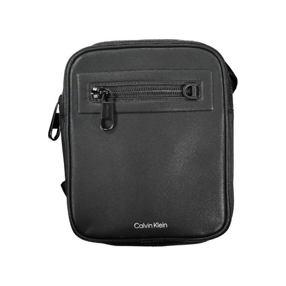 Shoulder Bag by Calvin Klein for men in polyester & polyethylene black features an effortlessly chic silhouette with a secure magnetic, ample external-pockets & internal-pockets, and versatile shoulder-strap & adjustable-strap for effortlessly chic everyday luxury.