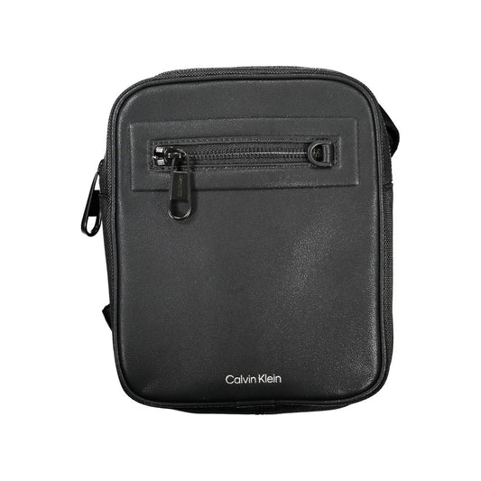 Shoulder Bag by Calvin Klein for men in polyester & polyethylene black features an effortlessly chic silhouette with a secure magnetic, ample external-pockets & internal-pockets, and versatile shoulder-strap & adjustable-strap for effortlessly chic everyday luxury.