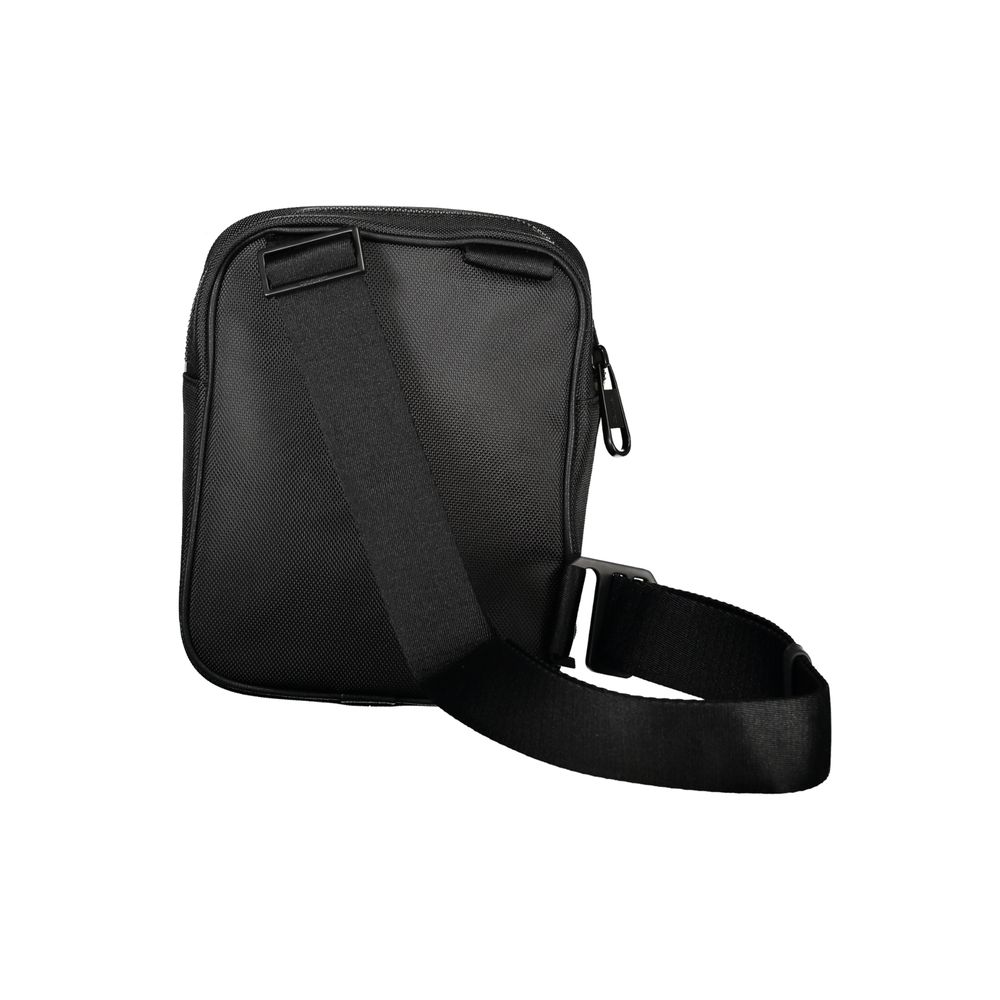 Shoulder Bag by Calvin Klein for men in polyester & polyethylene black features a stately silhouette, showcasing a secure magnetic, ample external-pockets & internal-pockets, and stately shoulder-strap & adjustable-strap for a stately finish.