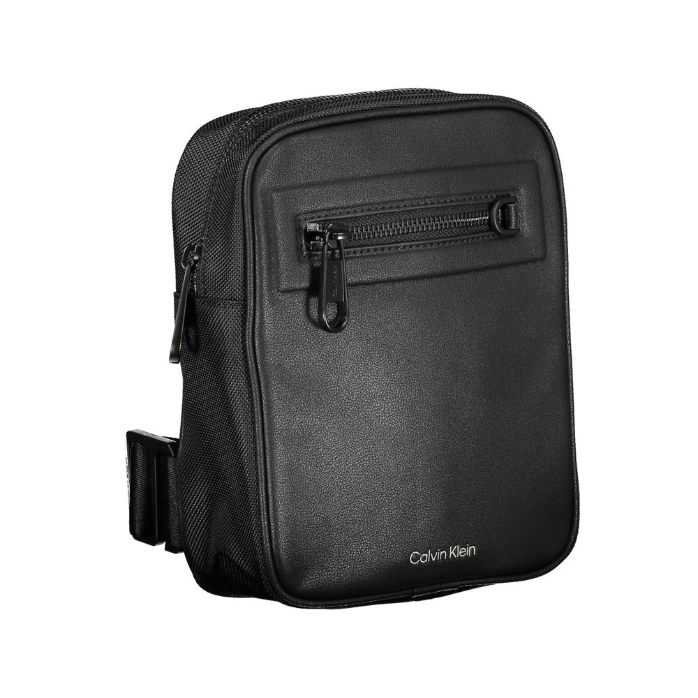 Shoulder Bag by Calvin Klein for men in polyester & polyethylene black presents a statuesque silhouette, showcasing a secure magnetic and statuesque external-pockets & internal-pockets with versatile shoulder-strap & adjustable-strap for a sophisticated look.