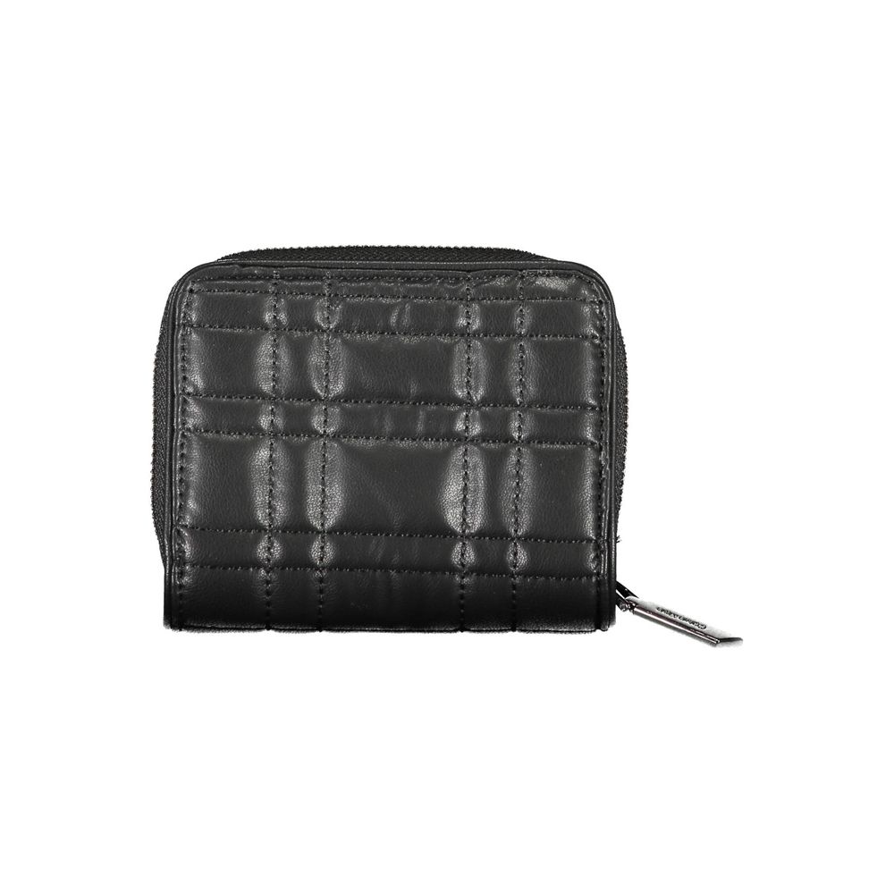 Wallet by Calvin Klein for women in polyester polyethylene faux leather black showcases a discerning silhouette, artfully capturing the essence of Polyester Polyethylene Faux Leather Wallet with its functional compact-design rfid-protection.