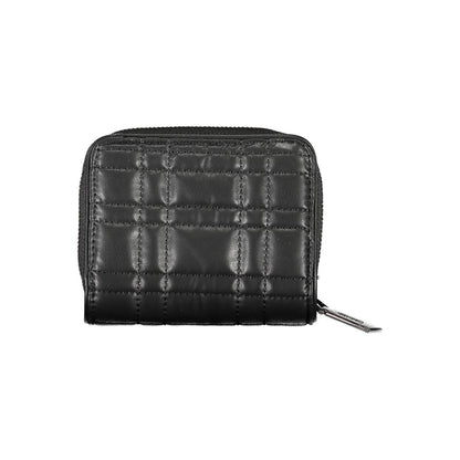 Wallet by Calvin Klein for women in polyester polyethylene faux leather black showcases a discerning silhouette, artfully capturing the essence of Polyester Polyethylene Faux Leather Wallet with its functional compact-design rfid-protection.