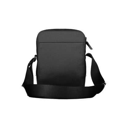 Shoulder Bag by Calvin Klein for men in polyester & polyethylene black features an effortlessly chic silhouette with a secure zipper, ample external-pockets & internal-pockets, and versatile shoulder-strap & adjustable-strap for effortlessly chic everyday luxury.