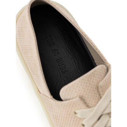 Sneakers by Fear Of God for men in suede leather & rubber beige presents a sumptuous silhouette, artfully capturing the essence of the Men's Low Top Suede Leather & Rubber Sneakers with its sumptuous low-top style design.