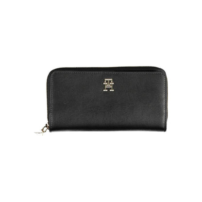 Wallet by Tommy Hilfiger for women in polyethylene faux leather black showcases a refined silhouette, artfully capturing the essence of the refined Polyethylene Faux Leather Wallet design with functional compact-design.