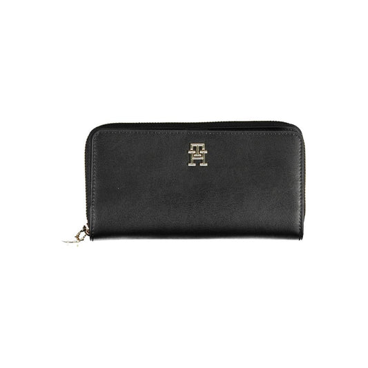 Wallet by Tommy Hilfiger for women in polyethylene faux leather black showcases a refined silhouette, artfully capturing the essence of the refined Polyethylene Faux Leather Wallet design with functional compact-design.