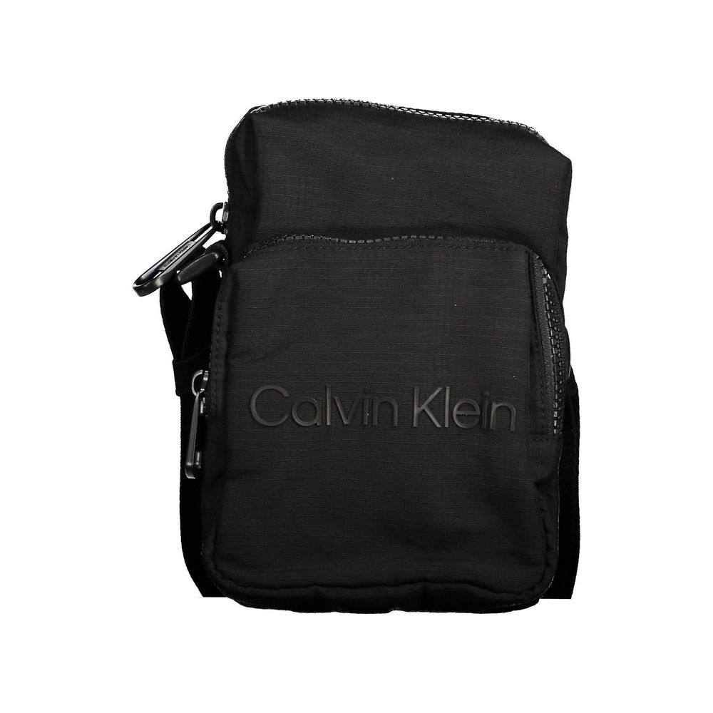 Shoulder Bag by Calvin Klein for men in nylon polyester & polyethylene black features a effortless chic silhouette with a secure zipper, ample external-pockets, and versatile shoulder-strap & adjustable-strap for a effortless chic finish.