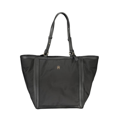 Shopper Tote Convertible Handbag by Tommy Hilfiger for women in polyester black features an exquisite silhouette, showcasing a secure zipper, ample internal-pockets, and exquisite adjustable-strap & handle for a sophisticated finish.