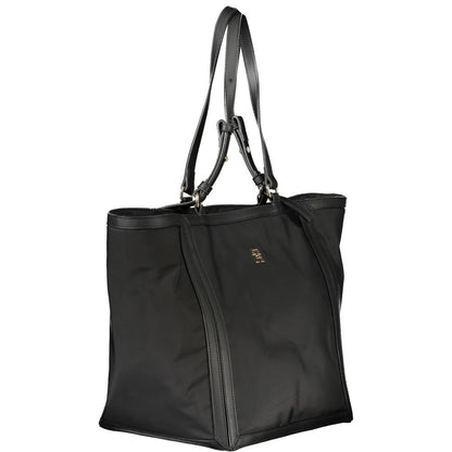 Shopper Tote Convertible Handbag by Tommy Hilfiger for women in polyester black features a polished silhouette with a secure zipper, ample internal-pockets, and polished adjustable-strap & handle for a sophisticated look.