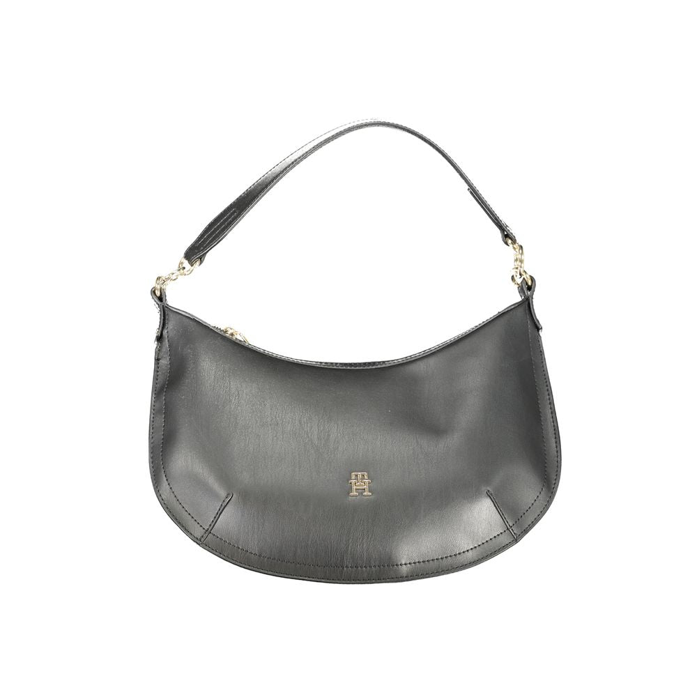 Handbag by Tommy Hilfiger for women in polyethylene black & signature features an refined silhouette, showcasing a secure zipper, ample internal-pockets, and versatile shoulder-strap, adjustable-strap & handle for a sophisticated refined aesthetic.