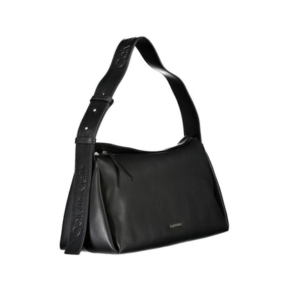Convertible Handbag by Calvin Klein for women in polyester faux leather black features a polished silhouette with a secure zipper, ample internal-pockets, and polished shoulder-strap, adjustable-strap & handle for a sophisticated look.