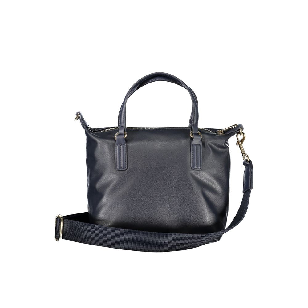Handbag by Tommy Hilfiger for women in polyester blue features a signature silhouette, showcasing a secure zipper and signature internal-pockets with versatile shoulder-strap, handle & adjustable-strap for a sophisticated look.