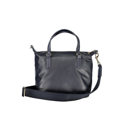 Handbag by Tommy Hilfiger for women in polyester blue features a signature silhouette, showcasing a secure zipper and signature internal-pockets with versatile shoulder-strap, handle & adjustable-strap for a sophisticated look.