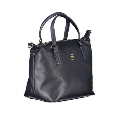 Handbag by Tommy Hilfiger for women in polyester blue features an refined silhouette, showcasing a secure zipper, ample internal-pockets, and versatile shoulder-strap, handle & adjustable-strap for a sophisticated refined aesthetic.