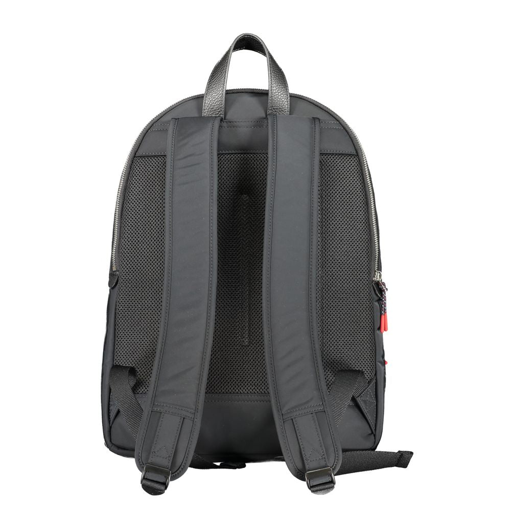 Backpack by Tommy Hilfiger for men in polyester black presents a stately Polyester Backpack design, showcasing a secure zipper with ample external-pockets, internal-pockets & laptop-compartment and versatile backpack-strap, adjustable-strap & handle for a stately finish.