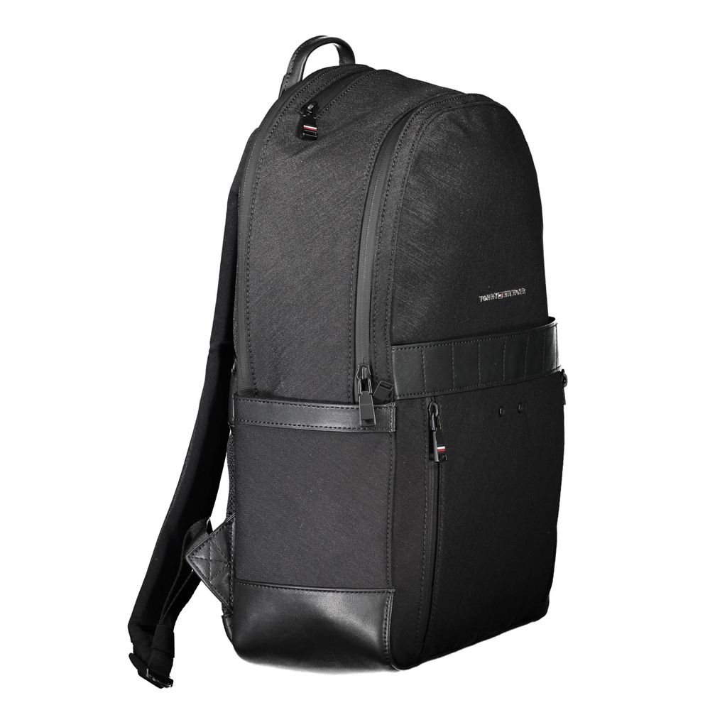 Backpack by Tommy Hilfiger for men in nylon polyester & polyethylene black features a stately Nylon Polyester & Polyethylene Backpack design, showcasing a secure snap & zipper, ample built-in-compartments, and versatile handle, backpack-strap & adjustable-strap for a stately finish.