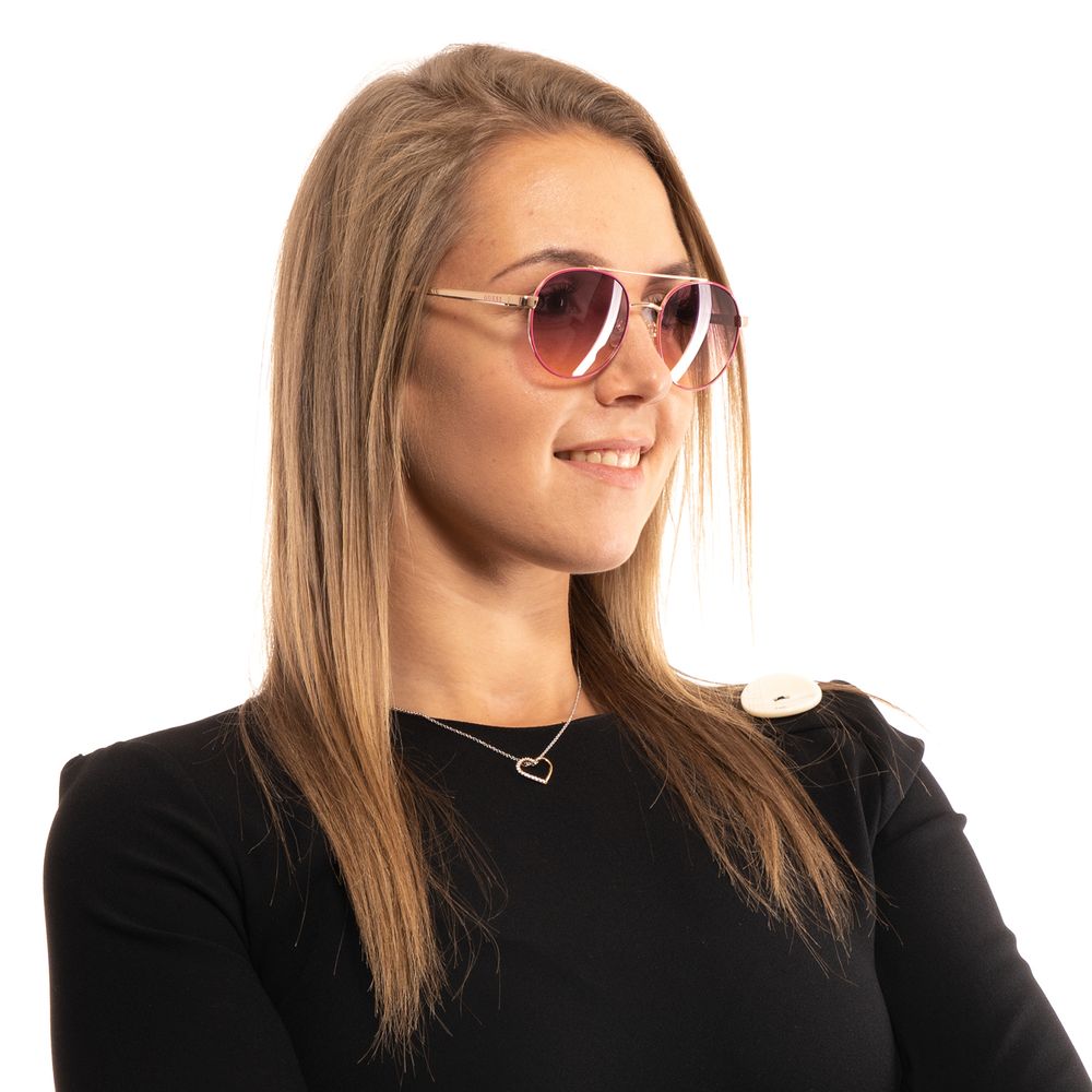Sunglasses by Guess for women in and pink featuring an opulent aviator full-rim frame design with a sophisticated rose coloured frame finish and high-performance gradient category-2-medium-tint lens.