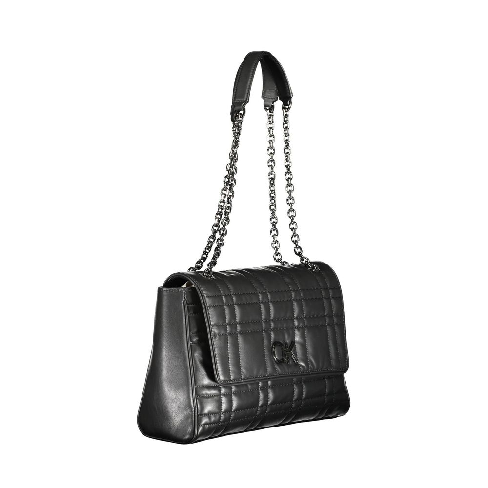 Shoulder Handbag by Calvin Klein for women in polyester polyethylene faux leather black presents a ornamental silhouette, showcasing a secure , ample built-in-compartments, external-pockets & internal-pockets, and versatile shoulder-strap & handle for a ornamental finish.