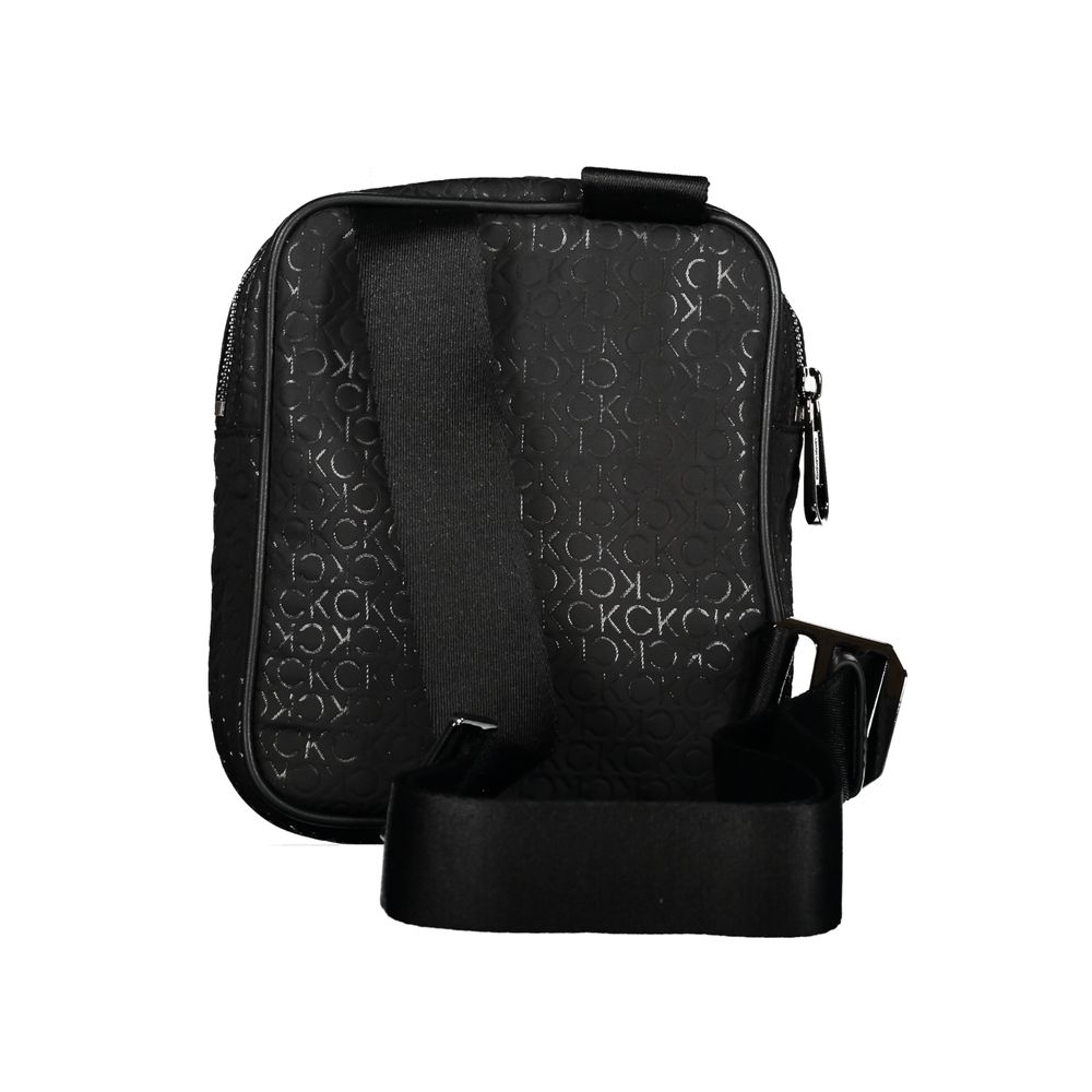 Shoulder Bag by Calvin Klein for men in polyester & polyethylene black showcases a statuesque silhouette, artfully detailed with a secure , organized external-pockets & internal-pockets, and versatile shoulder-strap & adjustable-strap for a statuesque look.