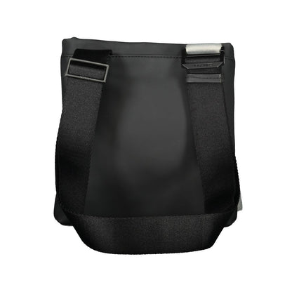 Shoulder Bag by Calvin Klein for men in polyester & polyethylene black features a stately silhouette, showcasing a secure zipper, ample external-pockets & internal-pockets, and stately shoulder-strap & adjustable-strap for a stately finish.