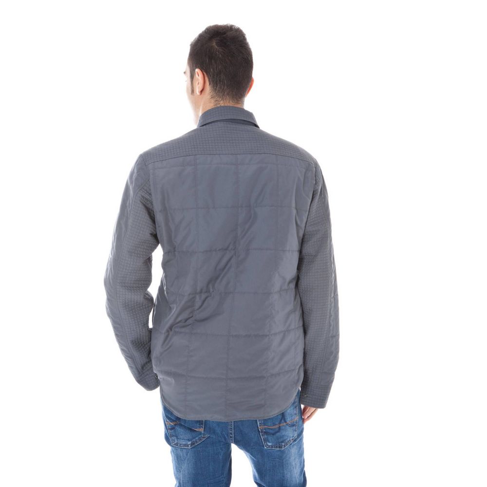 Jacket by Calvin Klein for men in polyester gray presents a impeccable silhouette, showcasing distinct pockets and a impeccable for a sophisticated finish.