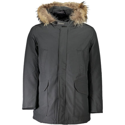 This Hooded Jacket by Woolrich for men in cotton & fur gray showcases a magnificent silhouette, meticulously crafted with a distinctive hooded neckline and functional pockets & hooded for a magnificent finish.