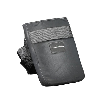 Shoulder Bag by Tommy Hilfiger for men in polyester black features a effortless sophistication silhouette, secured by a zipper with ample external-pockets & internal-pockets and versatile shoulder-strap & adjustable-strap for a effortless sophistication finish.