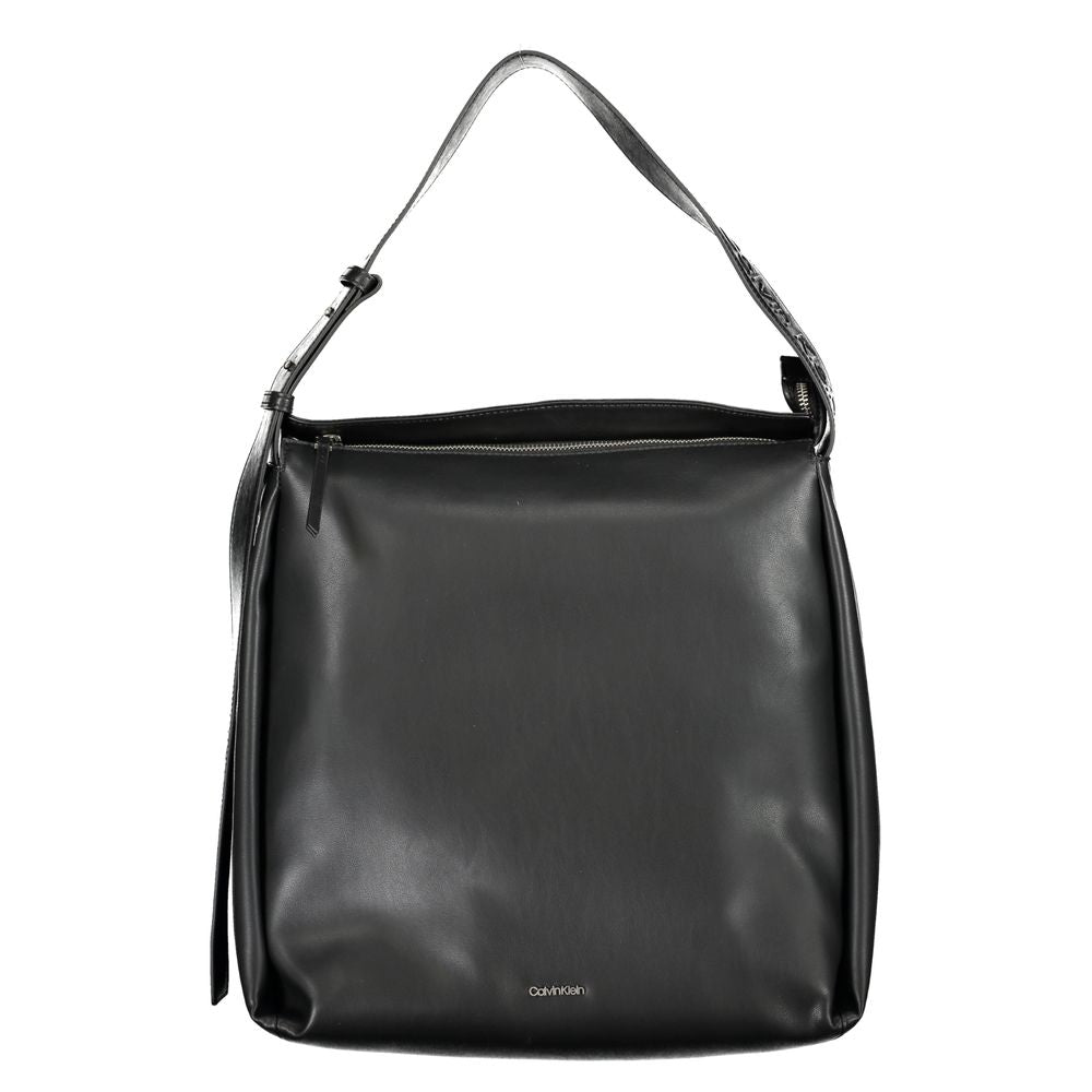 Large Convertible Handbag by Calvin Klein for women in polyester faux leather black presents a enviable design with a secure zipper, ample internal-pockets, and versatile shoulder-strap, adjustable-strap & handle for a sophisticated look.